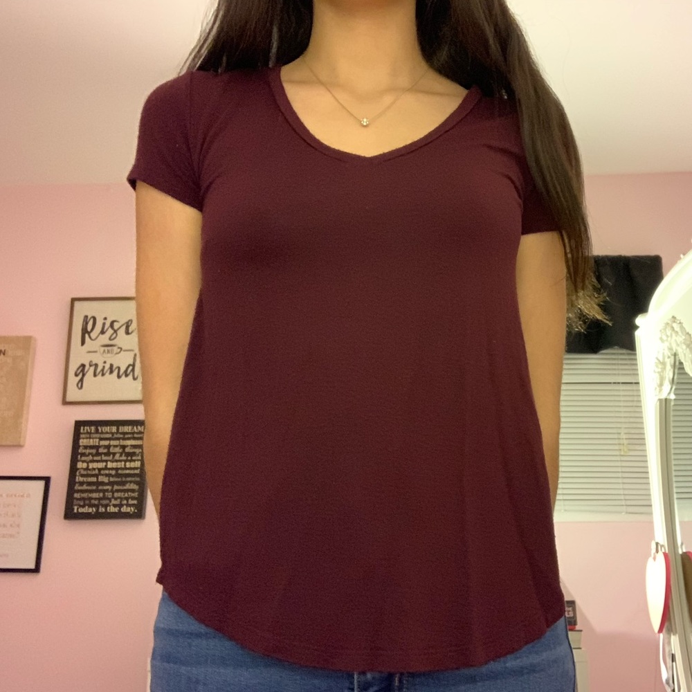 A maroon v neck top